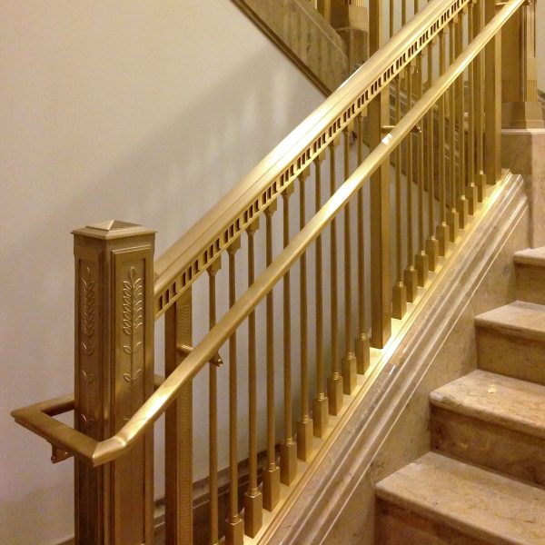 09-brass-staircase-railing-dmg-architectural